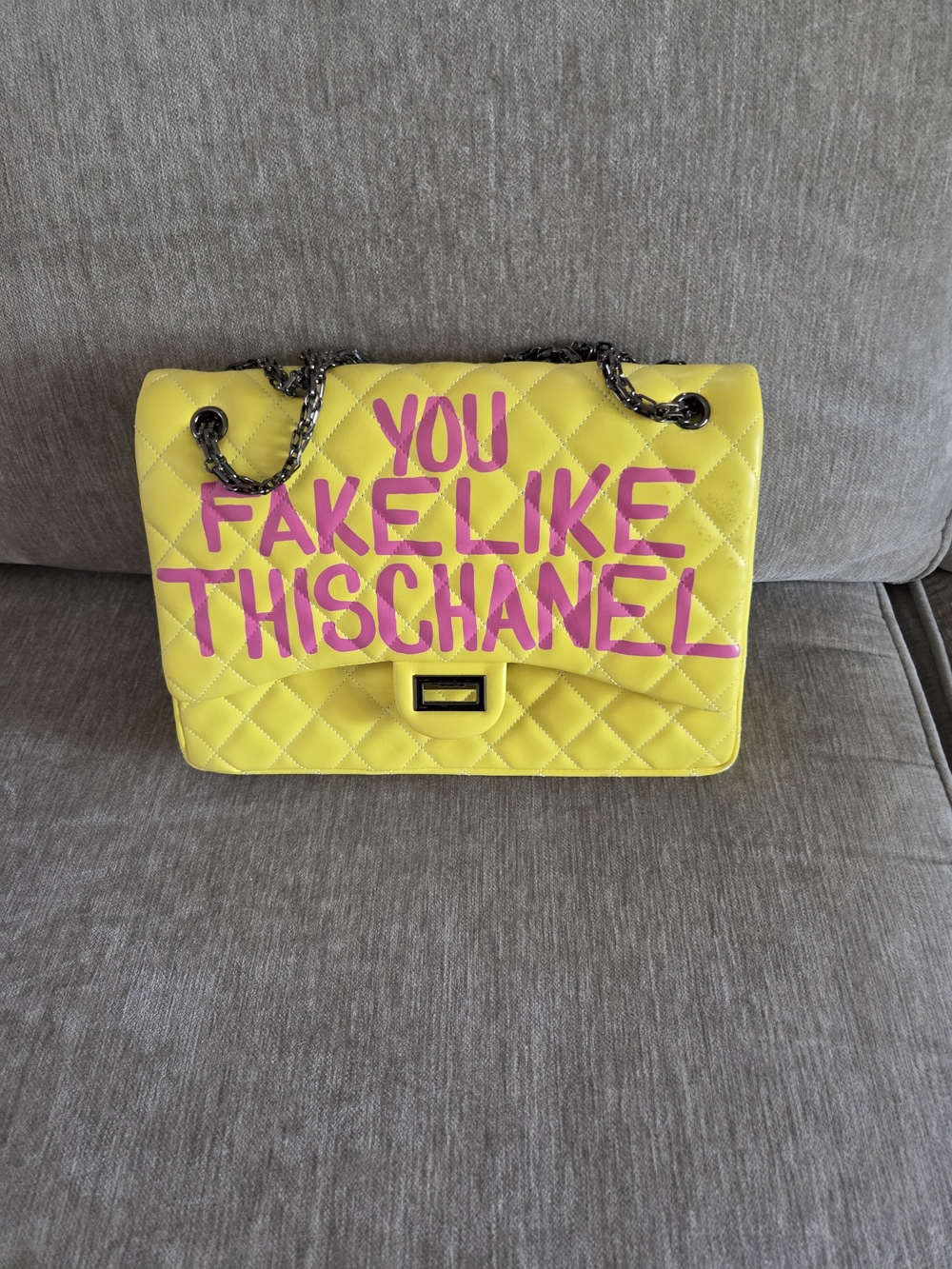 Bold Yellow Quilted Shoulder Bag with Pink Lettering